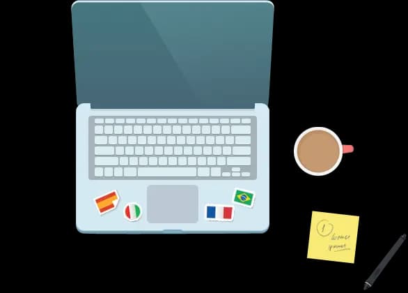 A laptop with language flag stickers, coffee, and a notepad
